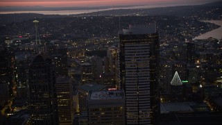 5K aerial stock footage orbit the Two Union Square skyscraper at twilight in Downtown Seattle, Washington Aerial Stock Footage | AX50_099