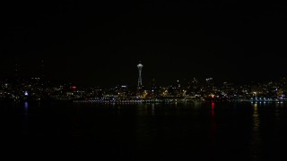 5K aerial stock footage fly over Elliott Bay to approach Space Needle, Downtown Seattle, Washington, night Aerial Stock Footage | AX51_012