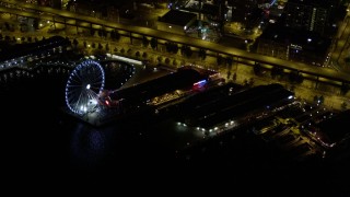 5K aerial stock footage of Waterfront piers, approach Seattle Great Wheel, Downtown Seattle, Washington, night Aerial Stock Footage | AX51_021E