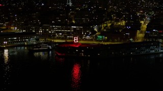 5K aerial stock footage of The Edgewater hotel at the Central Waterfront, Downtown Seattle, Washington, night Aerial Stock Footage | AX51_045