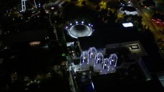 5K aerial stock footage of a bird's eye view of the Pacific Science Center at Seattle Center, Downtown Seattle, Washington, night Aerial Stock Footage | AX51_057