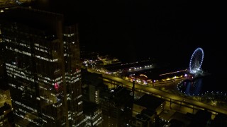 5K aerial stock footage of Seattle Great Wheel and the Alaskan Way Viaduct at Central Waterfront, Downtown Seattle, Washington, night Aerial Stock Footage | AX51_070