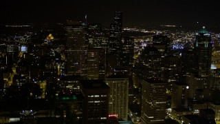 AX51_076E - 5K aerial stock footage approach top of Two Union Square in Downtown Seattle, Washington, night