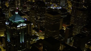 5K aerial stock footage flyby 1201 3rd Avenue Tower to reveal base of Rainier Tower in Downtown Seattle, Washington, night Aerial Stock Footage | AX51_088E