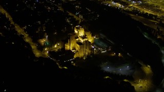 AX51_091E - 5K aerial stock footage approach and flyby Pacific Tower on Beacon Hill, Seattle, Washington, night