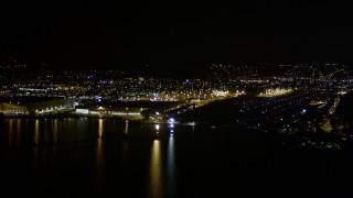 AX51_099E - 5K aerial stock footage approach Boeing Factory and Renton Municipal Airport on the shore of Lake Washington, night