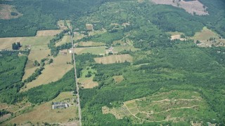 5K aerial stock footage fly away from farms in Silver Creek, Washington Aerial Stock Footage | AX52_013