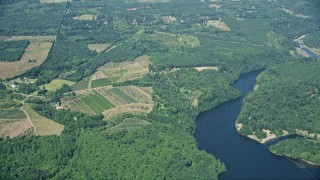 AX52_014E - 5K aerial stock footage fly away from farms, fields, and Mayfield Lake, Silver Creek, Washington