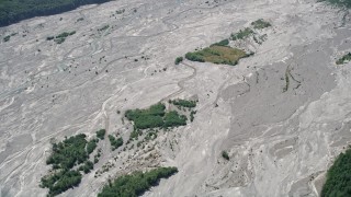 5K aerial stock footage of reverse view of the North Fork Toutle River, full of sediment, in Washington Aerial Stock Footage | AX52_026