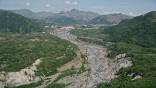 AX52_038 - 5K aerial stock footage of gray sediment flow in the North Fork Toutle River, Washington