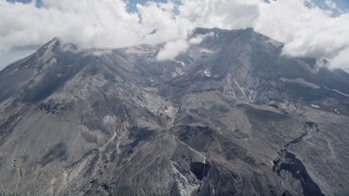 5K aerial stock footage pass the Mount St. Helens crater with clouds, Washington Aerial Stock Footage | AX52_049