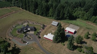 5K aerial stock footage of a large farmhouse with red barns, La Center, Washington Aerial Stock Footage | AX52_076