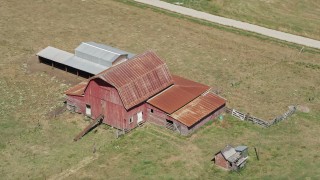 5K aerial stock footage approach and flyby an old red barn in a farm field in La Center, Washington Aerial Stock Footage | AX52_077E