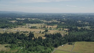 5K aerial stock footage flyby small farms and evergreen trees in La Center, Washington Aerial Stock Footage | AX52_081