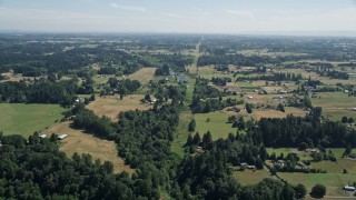 5K aerial stock footage of small farms and fields with trees in Ridgefield, Washington Aerial Stock Footage | AX52_084