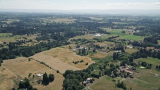 5K aerial stock footage fly over farms with green and brown farm fields in Ridgefield, Washington Aerial Stock Footage | AX52_086