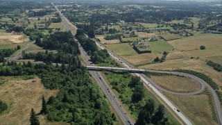 5K aerial stock footage approach I-5 with light traffic beside farm fields in Ridgefield, Washington Aerial Stock Footage | AX52_087E