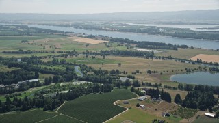 5K aerial stock footage approach wide farm fields near the Columbia River in Ridgefield, Washington Aerial Stock Footage | AX52_091