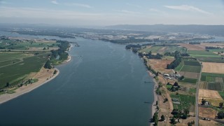 5K aerial stock footage of Columbia River between Washington and Riverview, Oregon farmland Aerial Stock Footage | AX52_098E