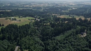 5K aerial stock footage fly over forest, rural homes and small farms around a country road in Hillsboro, Oregon Aerial Stock Footage | AX52_107E