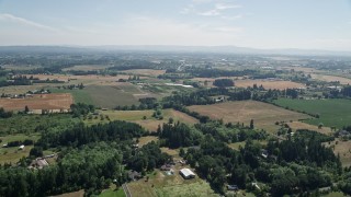 5K aerial stock footage of flying over farms and fields in Hillsboro, Oregon Aerial Stock Footage | AX52_110