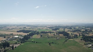 5K aerial stock footage pass by large fields and farms in Hillsboro, Oregon Aerial Stock Footage | AX52_111