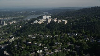 AX53_028E - 5K aerial stock footage fly away from Oregon Health and Science University with downtown in the distance, Portland, Oregon