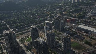 AX53_062E - 5K aerial stock footage fly away from John Ross Tower, The Ardea and South Waterfront skyscrapers, Portland, Oregon