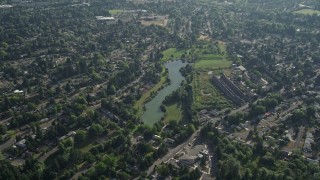 5K aerial stock footage flyby a lake in a suburban neighborhood, Beaverton, Oregon Aerial Stock Footage | AX53_096