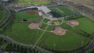 AX53_105 - 5K aerial stock footage of passing a sports and recreation complex, Hillsboro, Oregon