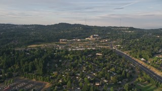 5K aerial stock footage of Providence St. Vincent Medical Center, highway interchange, Southwest Portland, Oregon, sunset Aerial Stock Footage | AX54_009E