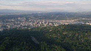 5K aerial stock footage of approaching Downtown Portland, seen from Southwest Portland, Oregon, sunset Aerial Stock Footage | AX54_016E