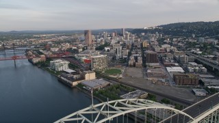 5K aerial stock footage of flying over the Fremont Bridge, approaching Downtown Portland, Oregon, sunset Aerial Stock Footage | AX54_024