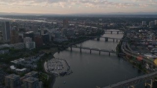 AX54_032 - 5K aerial stock footage pass by Marquam Bridge, tilt to reveal Downtown Portland, Oregon, sunset