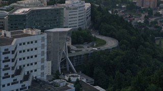 5K aerial stock footage orbit Oregon Health and Science University, reveal a gondola in Portland, Oregon, sunset Aerial Stock Footage | AX54_036