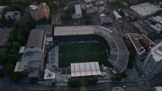 AX54_059 - 5K aerial stock footage approach Providence Park, formerly Jeld-Wen Field, Downtown Portland, Oregon, sunset