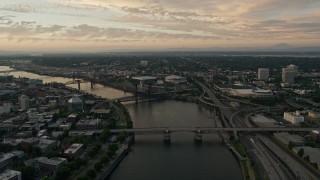 AX54_097 - 5K aerial stock footage of Willamette River, Rose Garden Arena, Memorial Coliseum, Portland, Oregon, twilight