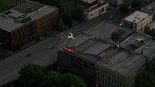 5K aerial stock footage of tracking the White Stag Sign, Portland, Oregon, twilight Aerial Stock Footage | AX54_098