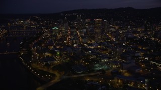 5K aerial stock footage flyby skyscrapers in downtown, Steel and Burnside Street Bridges, Downtown Portland, Oregon, twilight Aerial Stock Footage | AX55_009E