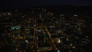 5K aerial stock footage approach skyscrapers, pan to reveal Hawthorne and Marquam Bridges, Downtown Portland, Oregon, night Aerial Stock Footage | AX55_040E