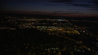 AX55_067 - 5K aerial stock footage of approaching Tanasbourne Town Center, Hillsboro, Oregon, night