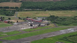 AX56_071 - 5K aerial stock footage of Astoria Regional Airport, located in Astoria, Oregon