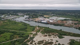 AX56_072 - 5K aerial stock footage approach a large lumber mill by the Skipanon River, Warrenton, Oregon