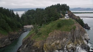 5K aerial stock footage of the Cape Disappointment Light on top of steep cliffs in Washington Aerial Stock Footage | AX56_098