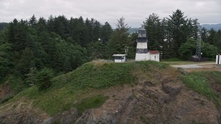 5K aerial stock footage approach and track the Cape Disappointment Light on top of a steep cliff in Washington Aerial Stock Footage | AX56_099