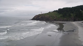 5K aerial stock footage approach and track the North Head Light on top of an oceanside cliff, Ilwaco, Washington Aerial Stock Footage | AX56_106E