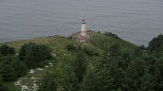 5K aerial stock footage flyby North Head Light, overlooking the Pacific Ocean in Ilwaco, Washington Aerial Stock Footage | AX56_114