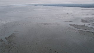 AX56_153 - 5K aerial stock footage of a view of Willapa Bay, Washington from wetlands on the shore