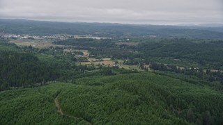 5K aerial stock footage of approaching small farms from evergreen forest in Raymond, Washington Aerial Stock Footage | AX56_171