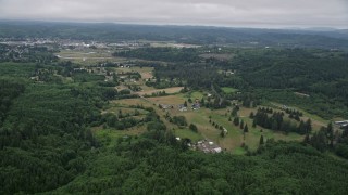 5K aerial stock footage approach small farms from the forest near the town of Raymond, Washington Aerial Stock Footage | AX56_172